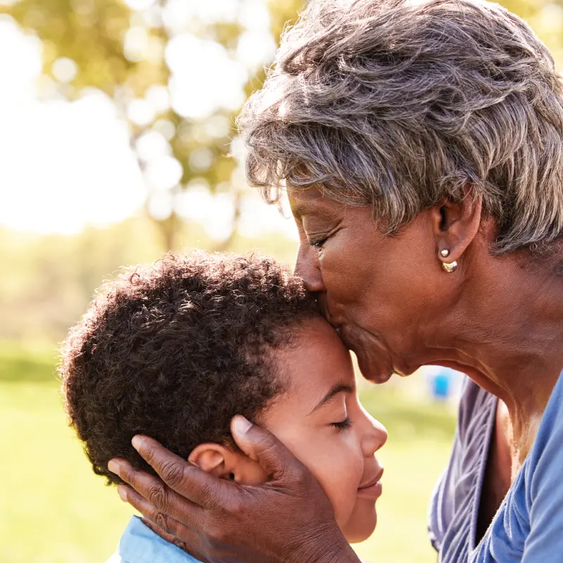 Grandmother kissing her grandson at The Courtyard at Fitchburg