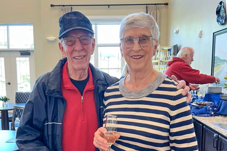 Couple at the grand opening drinking wine