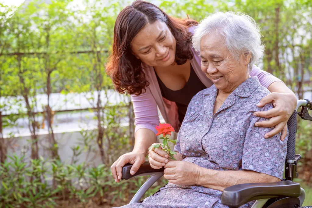 Adult daughter caring for her mother with dementia