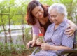 Adult daughter caring for her mother with dementia